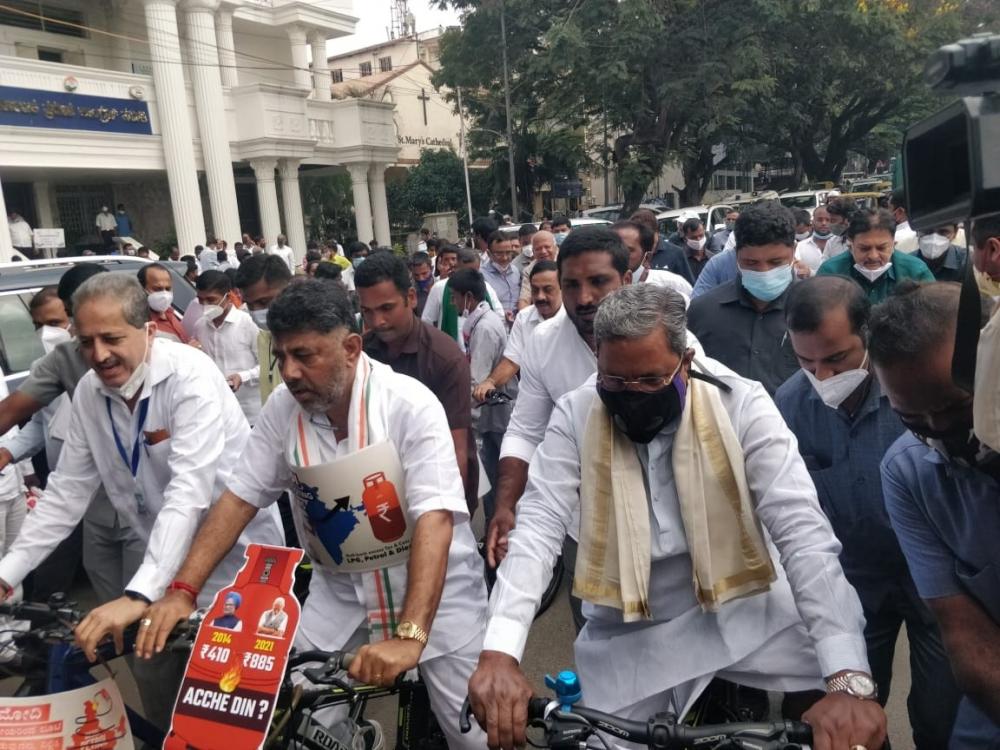 The Weekend Leader - K'taka Cong leaders ride bicycles to Assembly to protest price rise